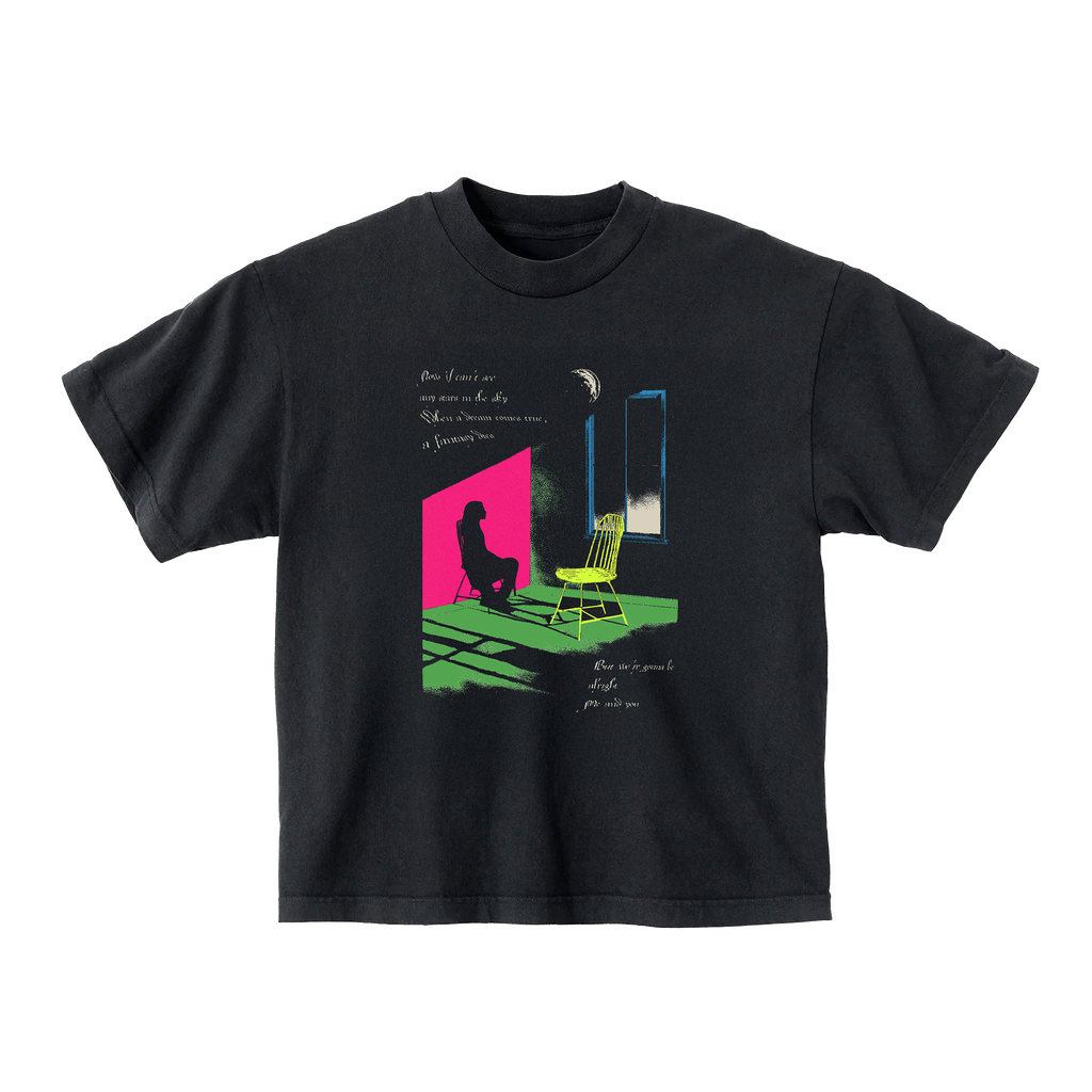 Black t-shirt with colorful graphic design on the front.
